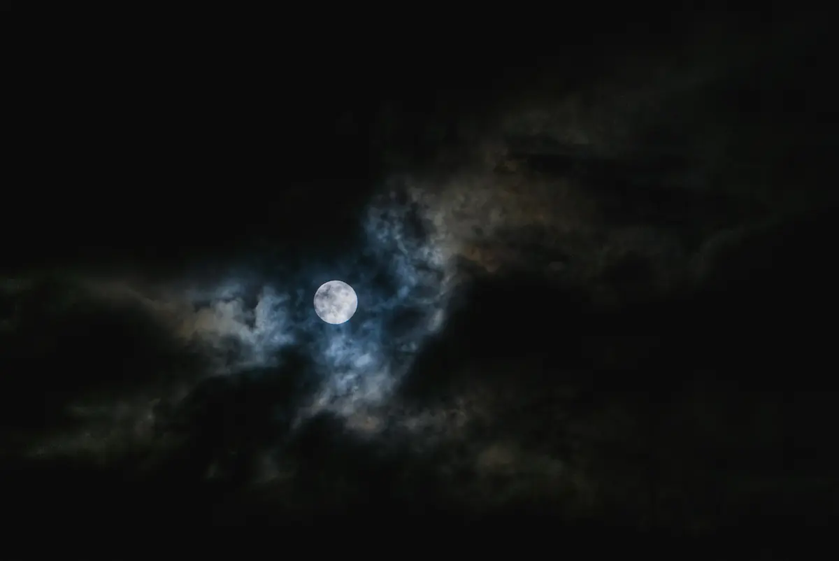 Moon with dark clouds