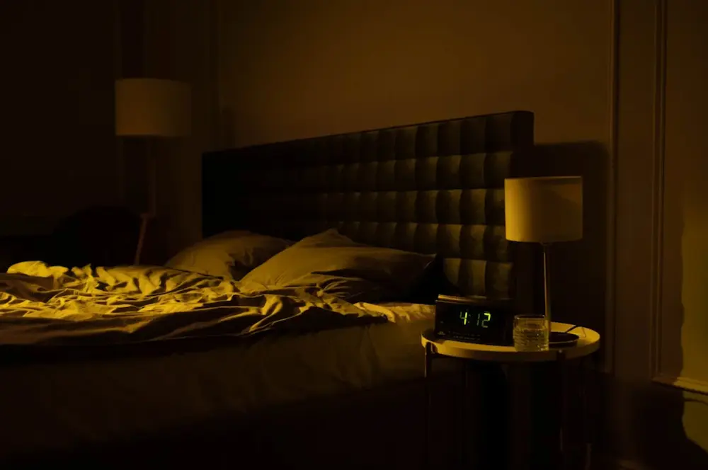Empty bed at night