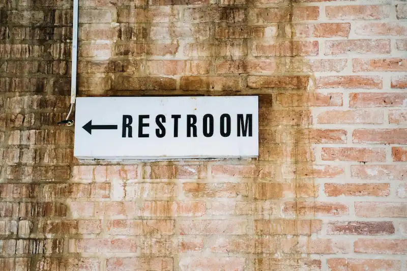Restroom sign on wall