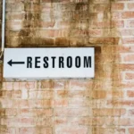 Restroom sign on wall